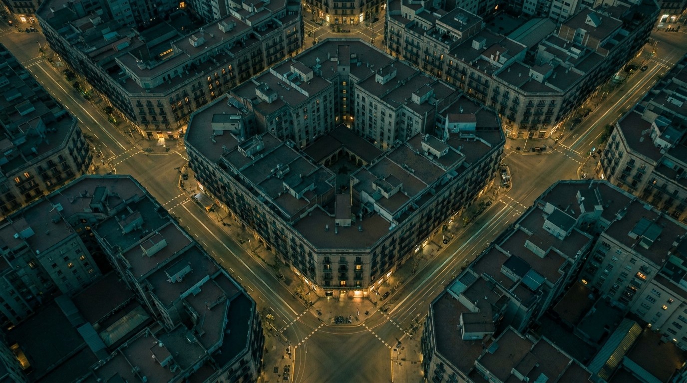 Aerial view of Barcelona's Eixample district at dusk, highlighting the competitive rental market — Housing Emergency Kit